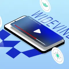 Smartfon z napisem WIDEVINE i ikonami symbolizującymi bezpieczeństwo. Widevine content decryption module to klucz do bezpiecznego streamingu.