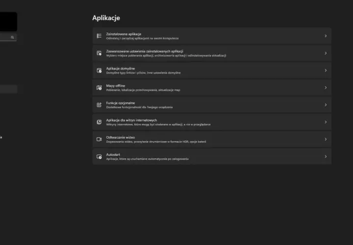 Ekran ustawień Windows z menu po lewej i sekcją "Aplikacje" po prawej.